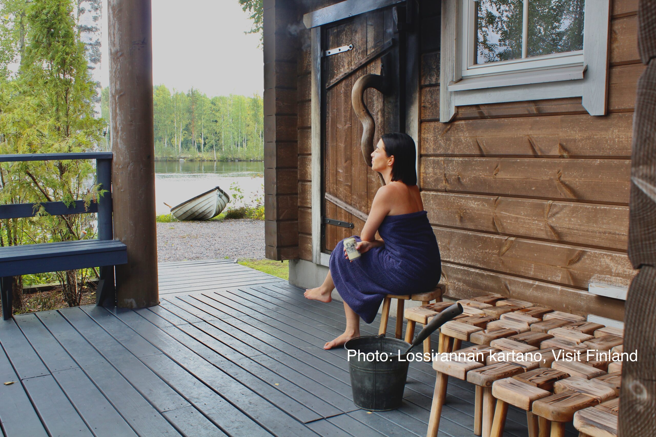 A woman resting outside sauna in Finland